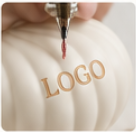Laser engraving logo on ceramic vase