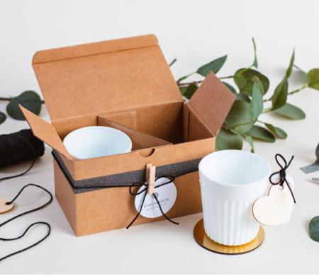 Custom packaging options for ceramic products including individual boxes, protective inserts and hang tags